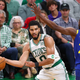 Andrew Wiggins helped keep Jayson Tatum at bay.
